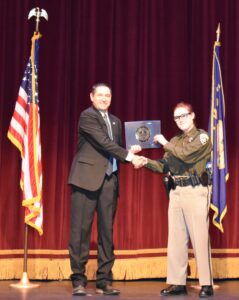 Attorney General Knudsen presents diploma to graduate of Law Enforcement Officer Basic Course 185